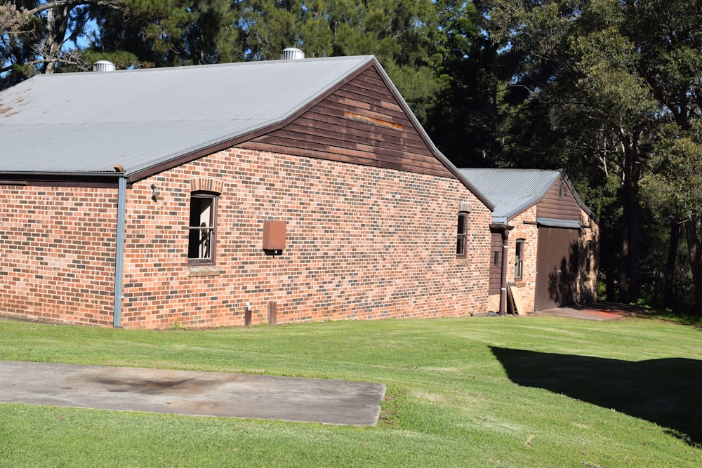 an old brick building with a metal roof