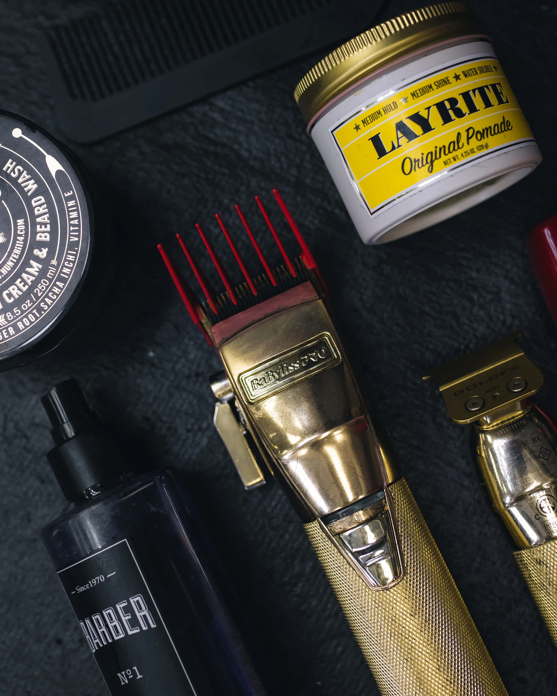 a collection of men's grooming products on a table