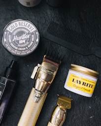 a close up of a shaving brush and other items