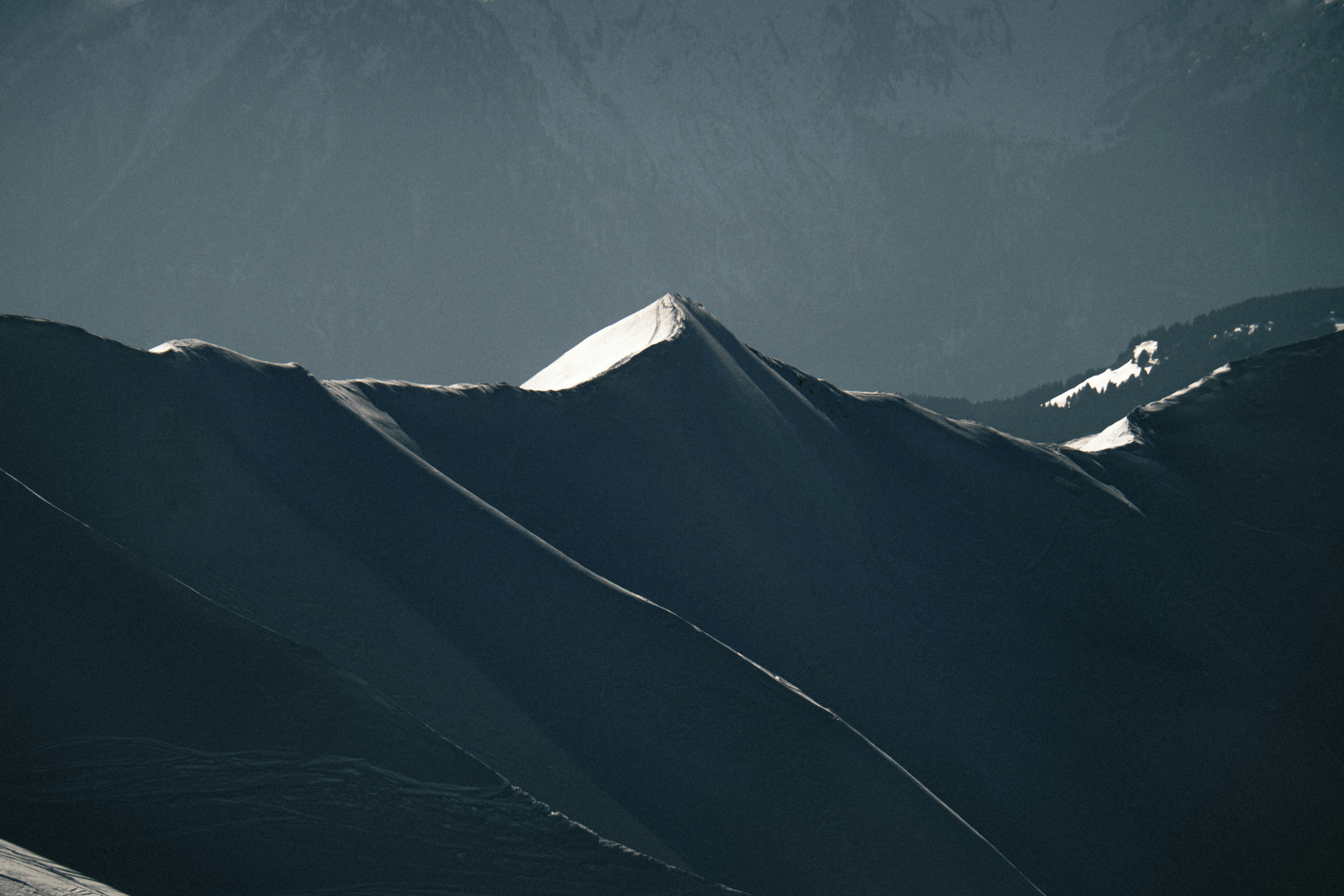 a person skiing down a snow covered mountain