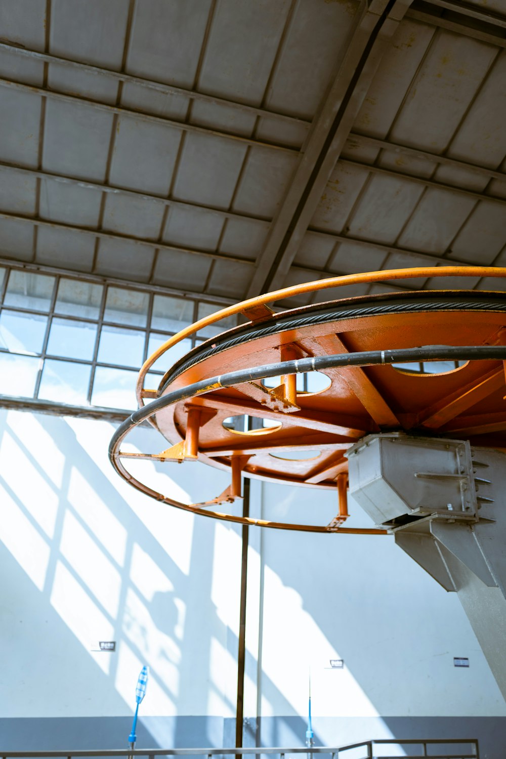 a large metal object hanging from the ceiling of a building