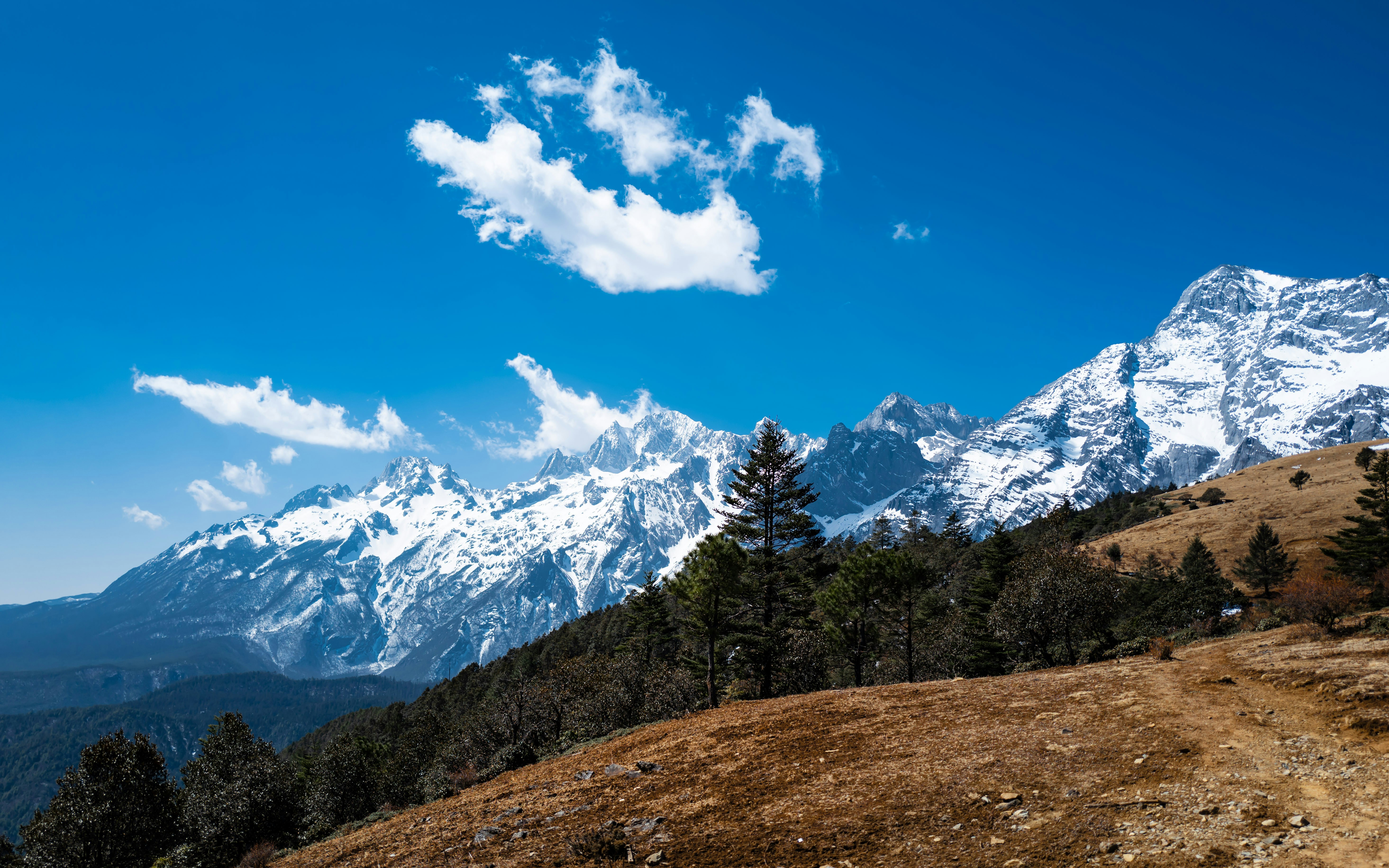 a view of a snow covered mountain range