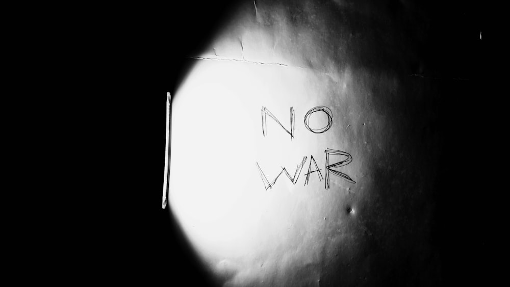 a black and white photo of a no war sign