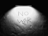 a black and white photo with the words no war written on it