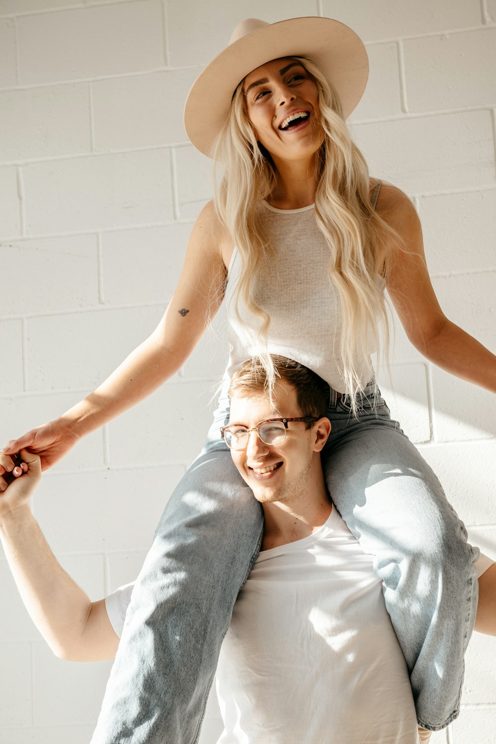 a man is holding a woman on his back