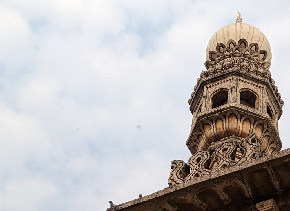 a tall tower with a clock on the top of it