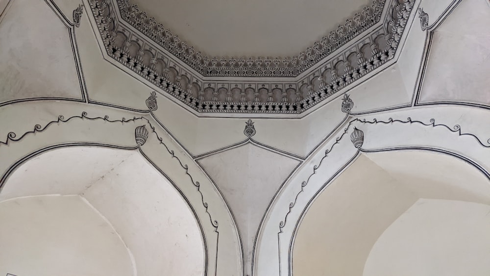 the ceiling of a building has intricate designs on it