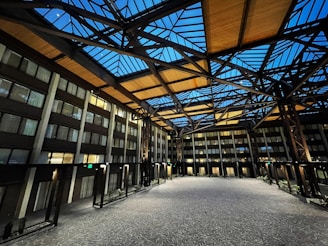 a building with a glass roof and a walkway