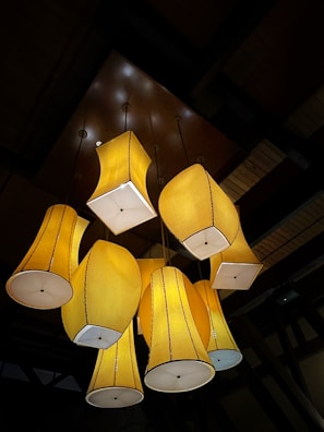 Artistic arrangement of multiple pasta lamp sculptures in a cozy living room.