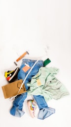 a pile of clothes sitting on top of a white floor
