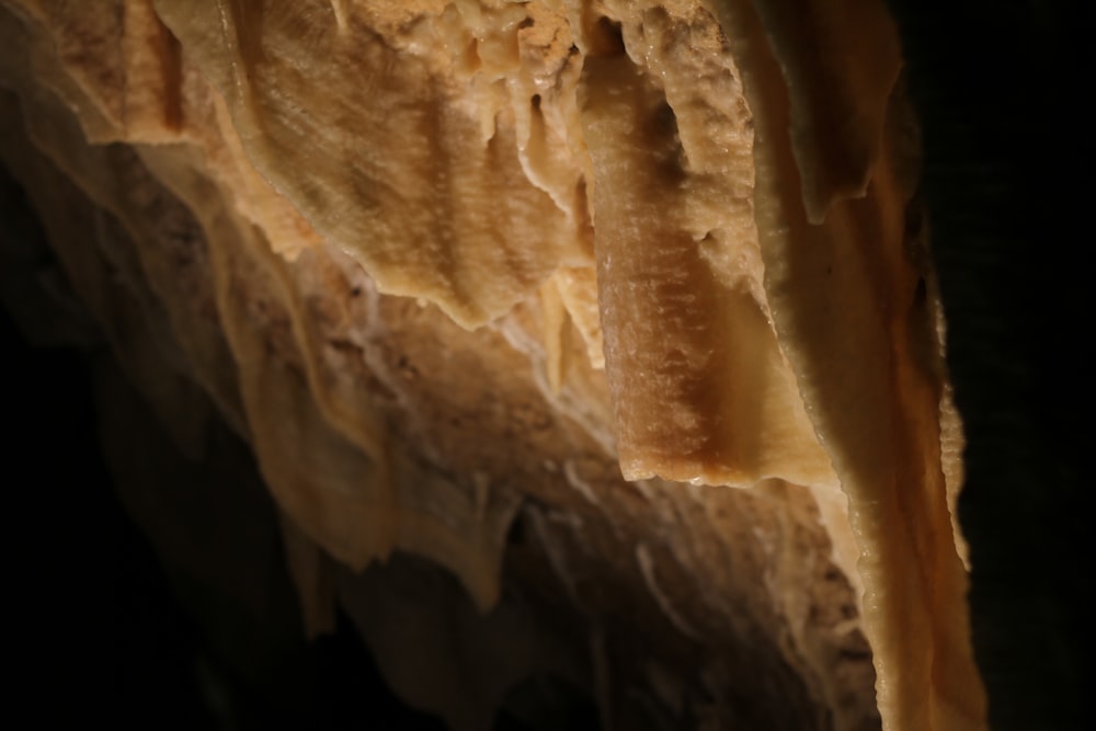 a close up of a piece of bread with icing on it