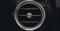 a close up of a speaker in a car