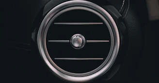 a close up of a speaker in a car