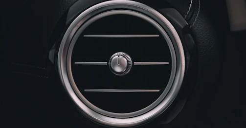 a close up of a speaker in a car