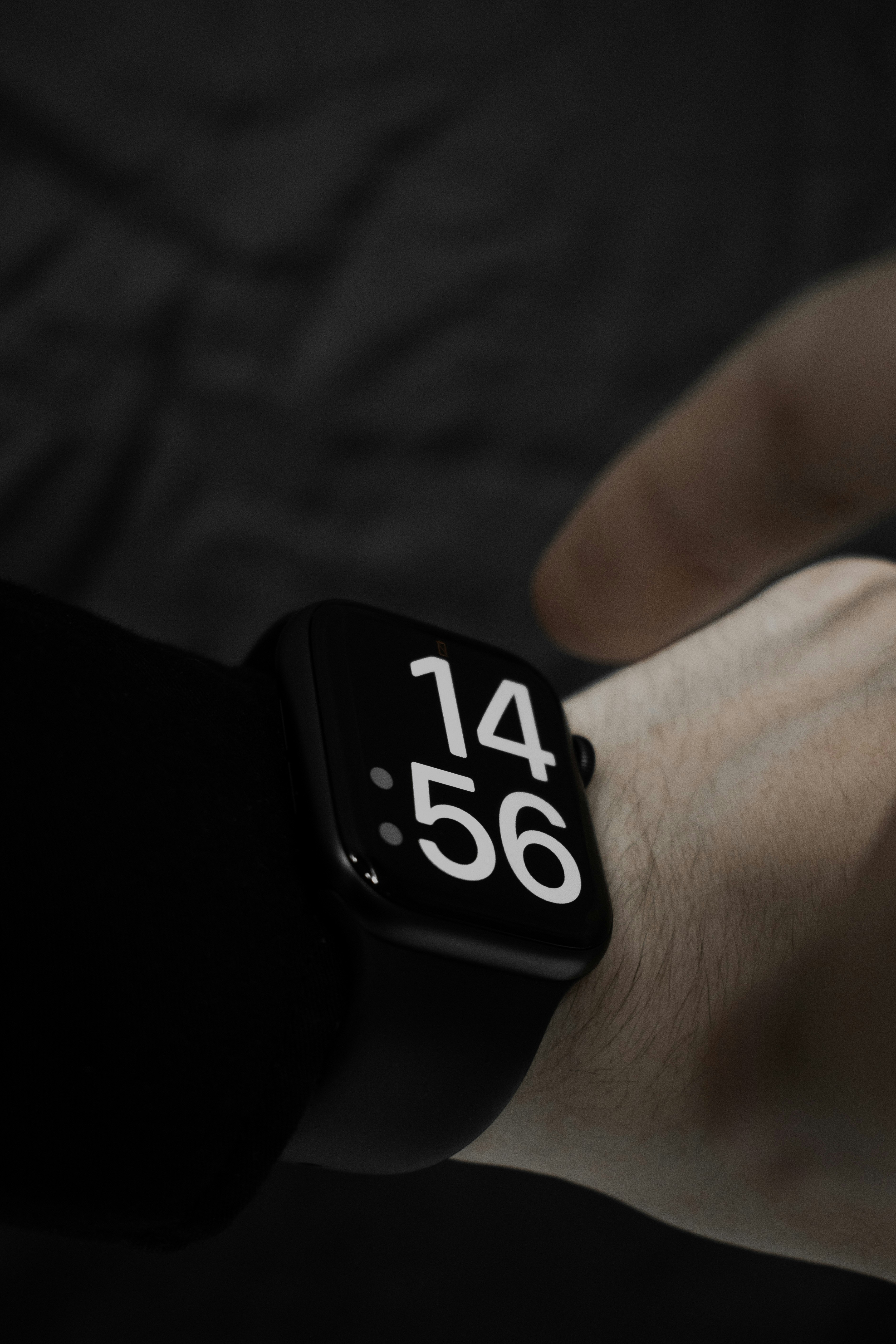 a person wearing an apple watch with the time displayed