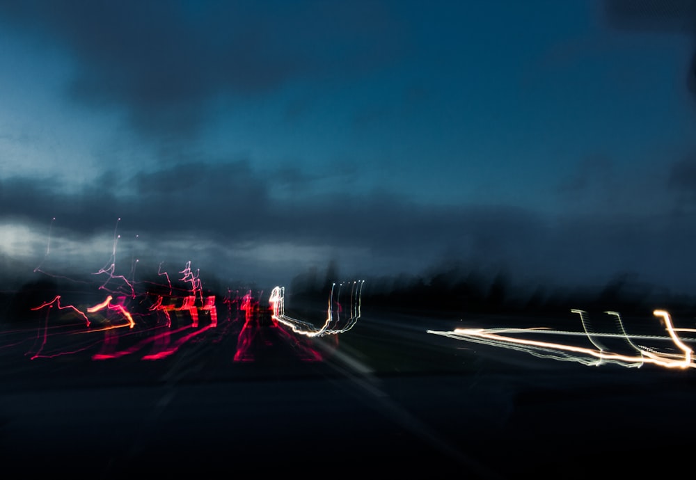 a blurry photo of a city street at night