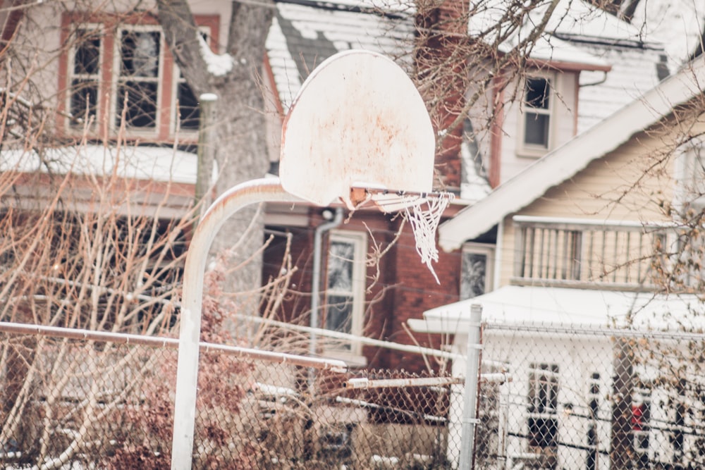 a basketball hoop in front of a house