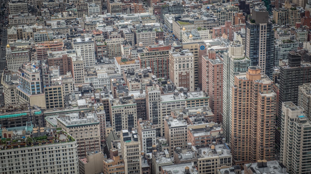 an aerial view of a city with tall buildings