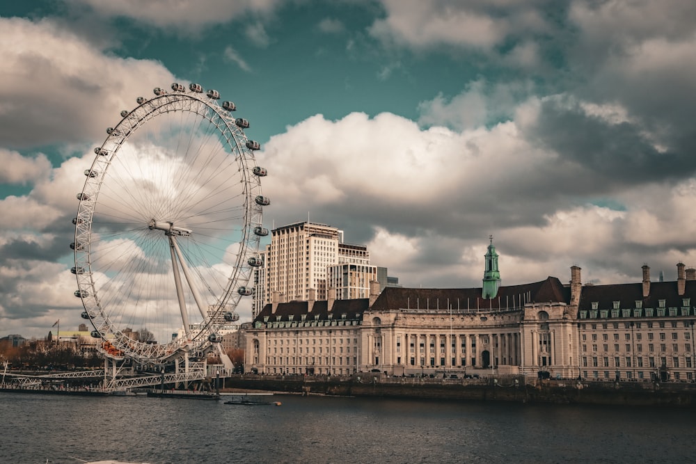 a large ferris wheel sitting next to a large building