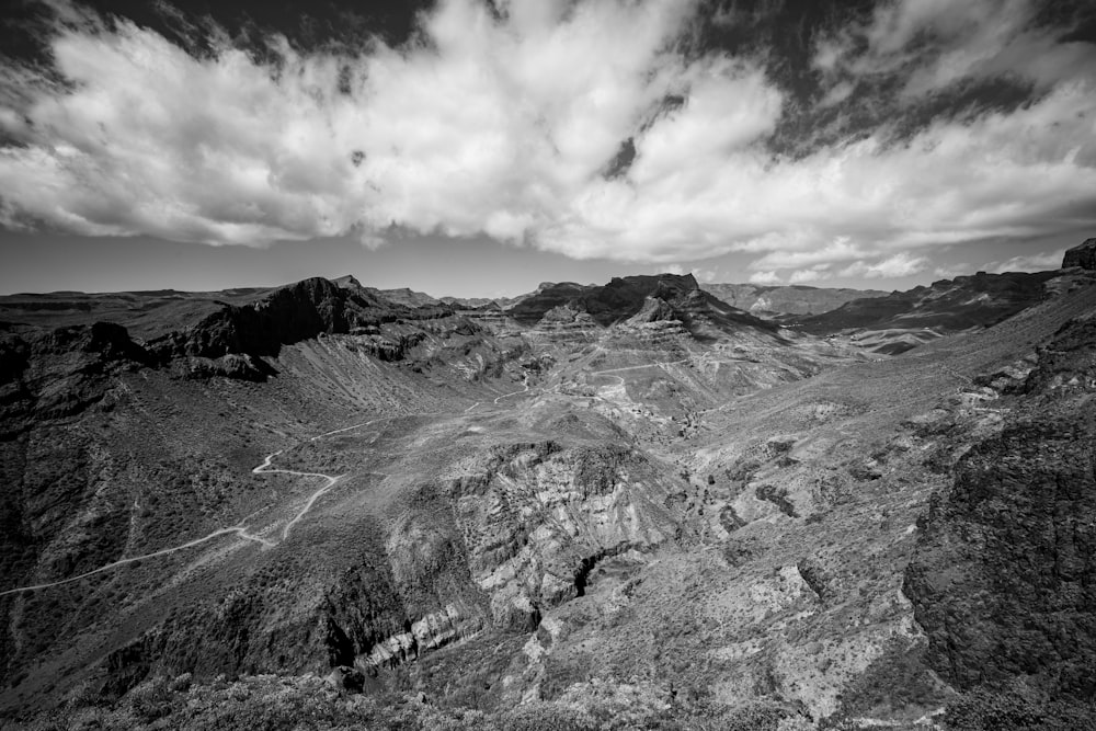 a black and white photo of a mountain range