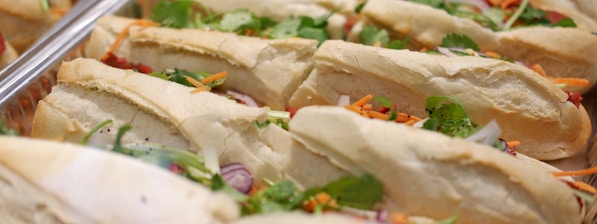 a close up of a tray of sandwiches