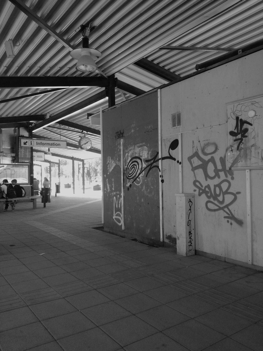 a black and white photo of a train station