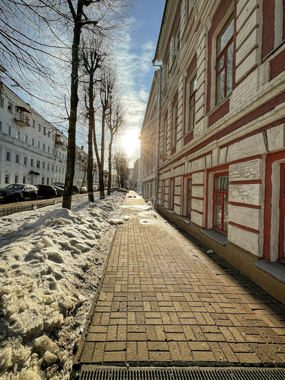 a sidewalk with a fire hydrant in the middle of it