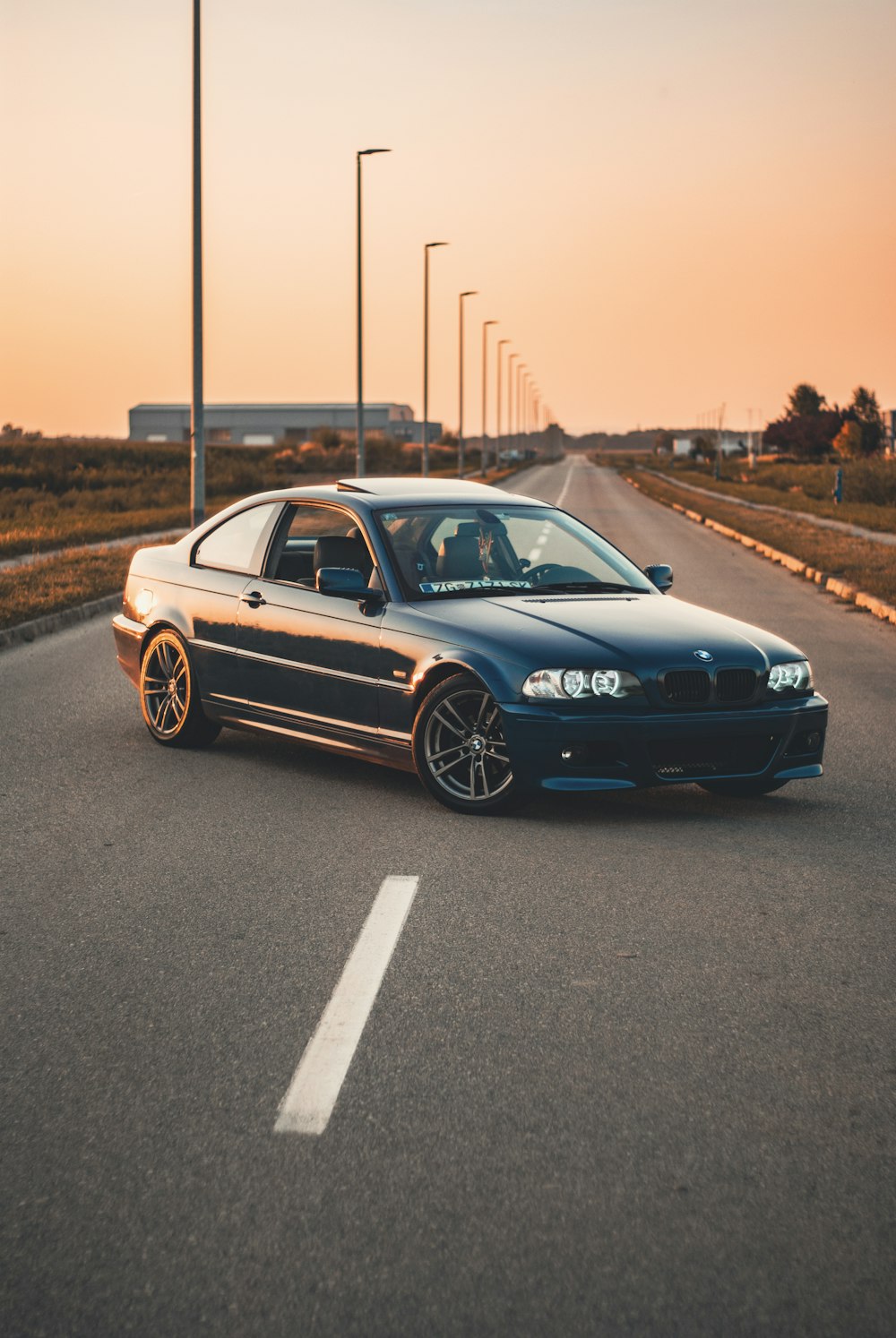 a black car parked on the side of the road