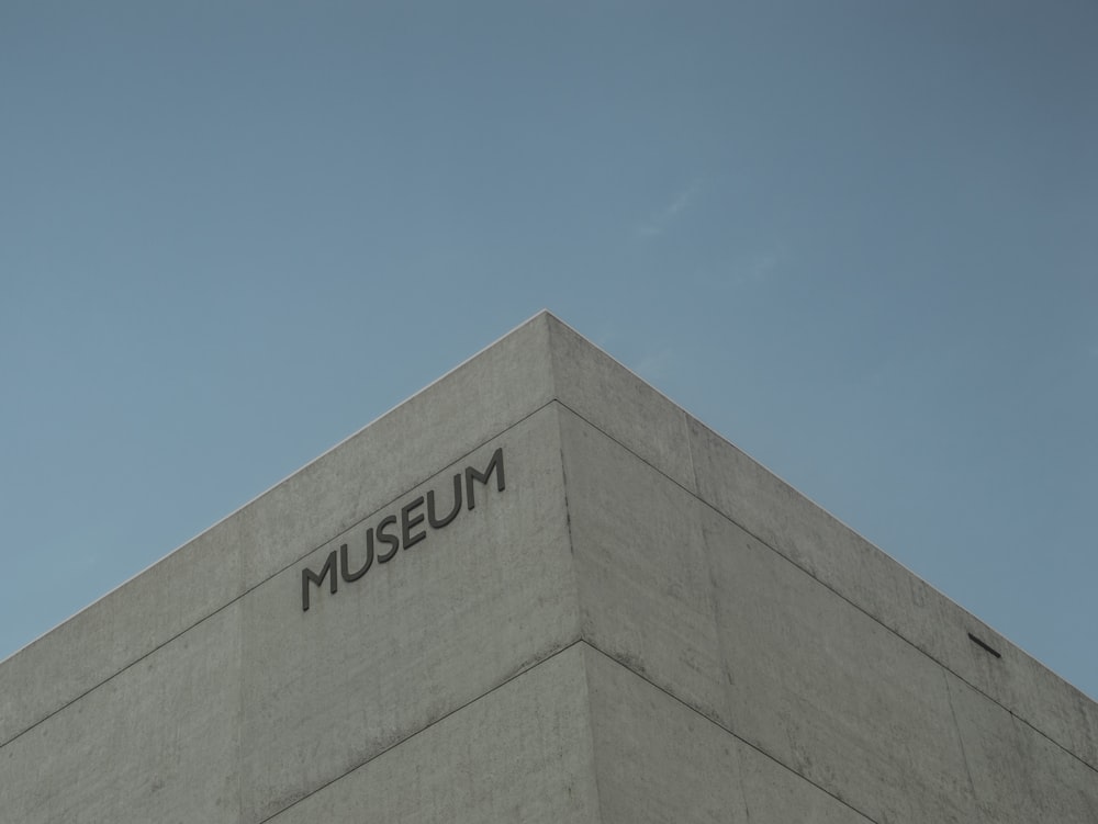 a tall building with a museum sign on it's side
