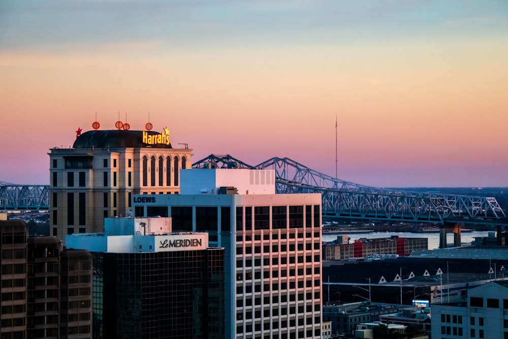 a city skyline with a bridge in the background