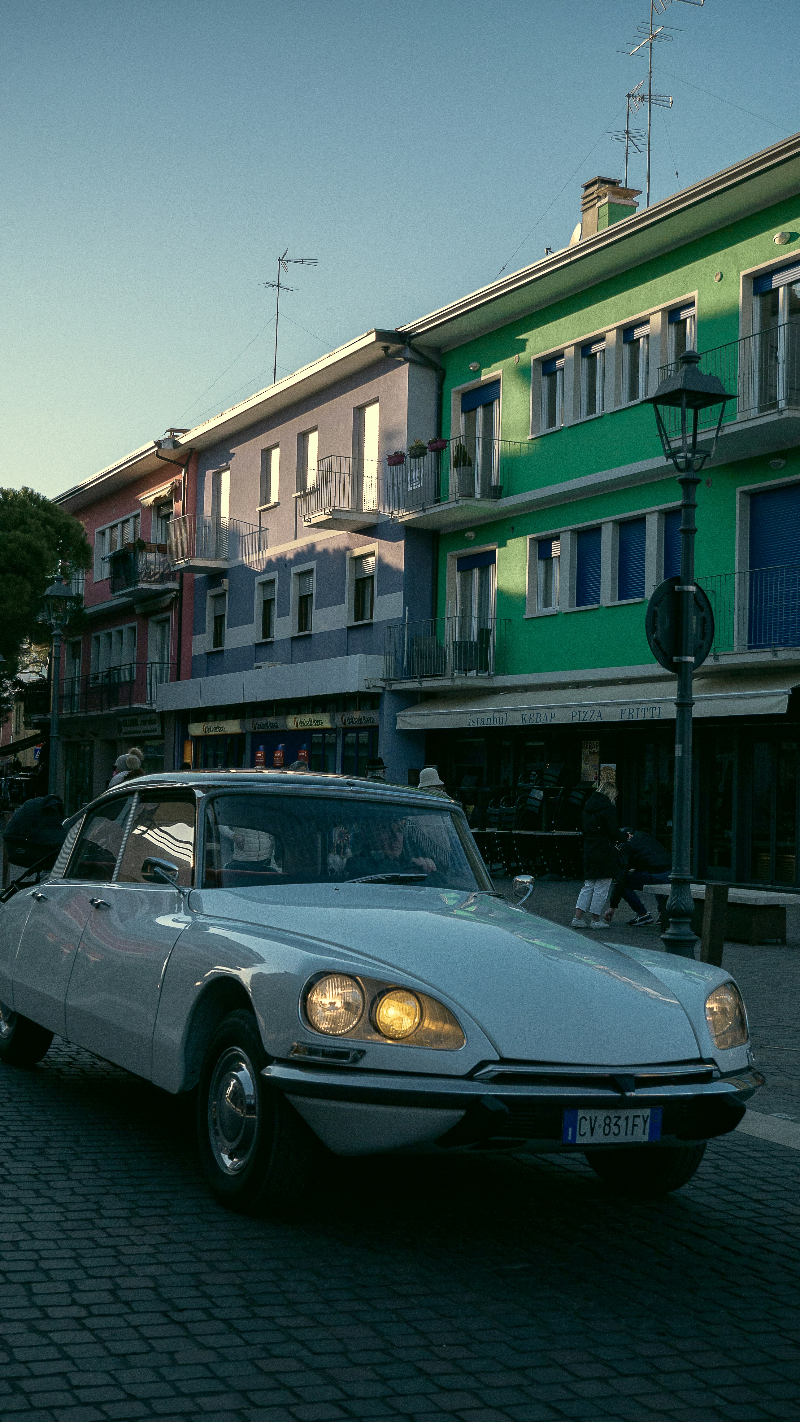 a white car parked on the side of the road