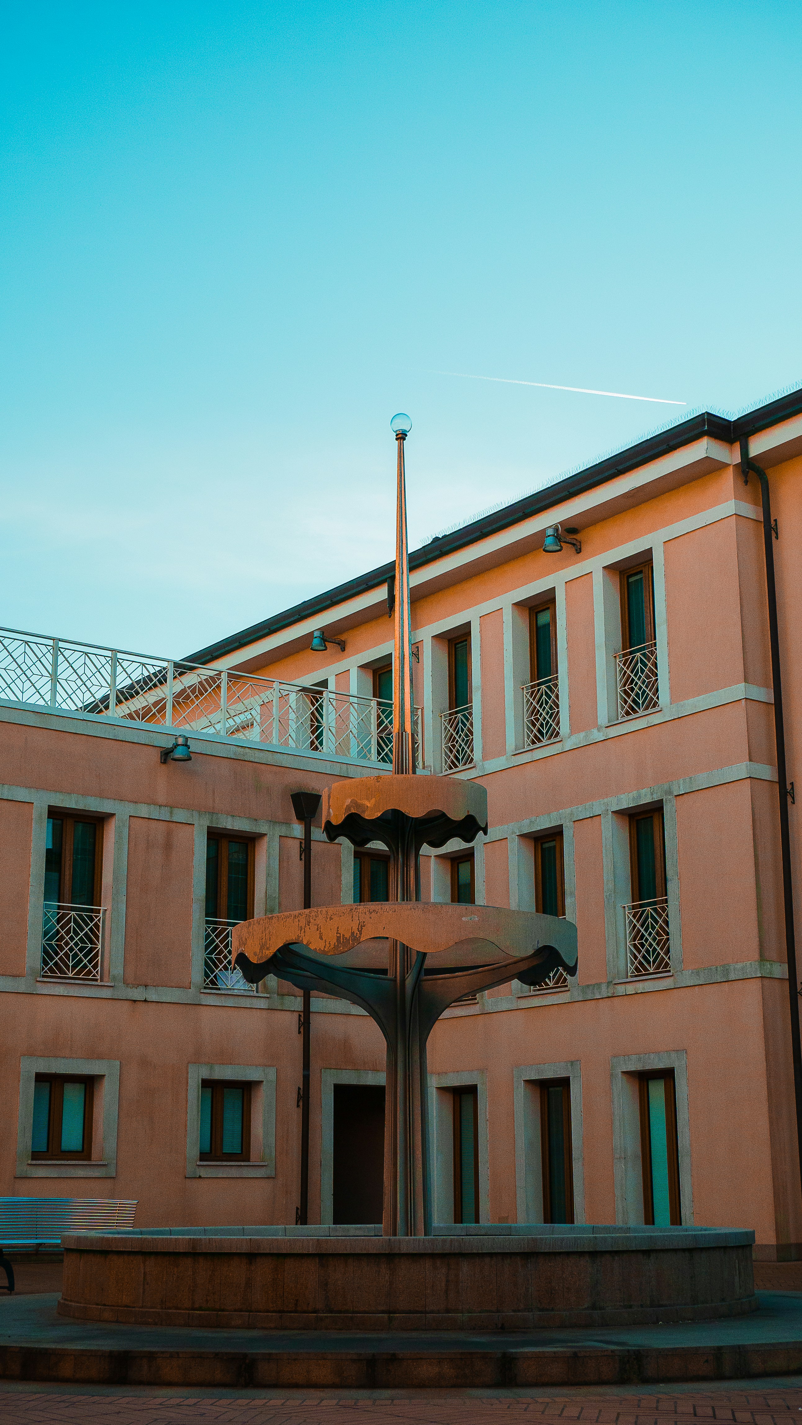 a building with a fountain in front of it