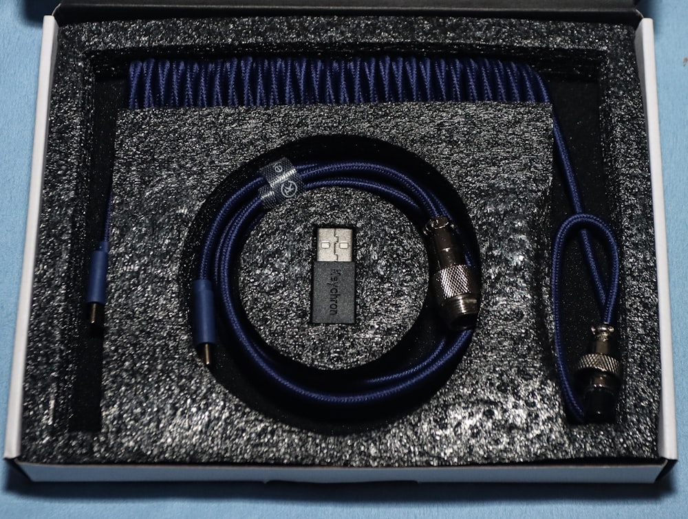 a box containing a microphone and a cable