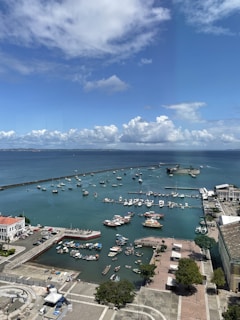 a harbor filled with lots of boats under a blue sky