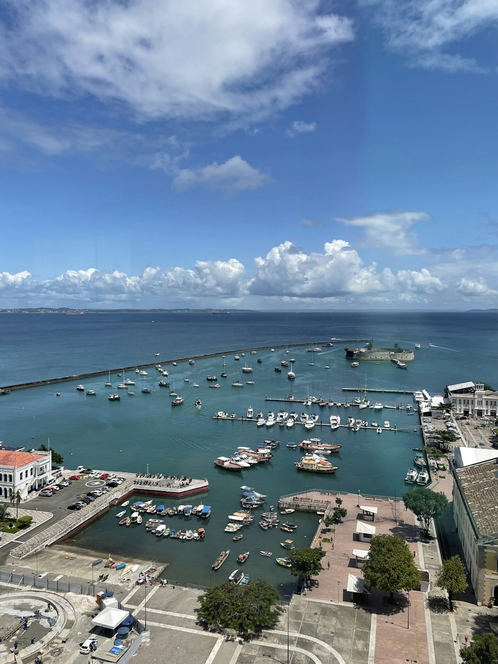 a harbor filled with lots of boats under a blue sky