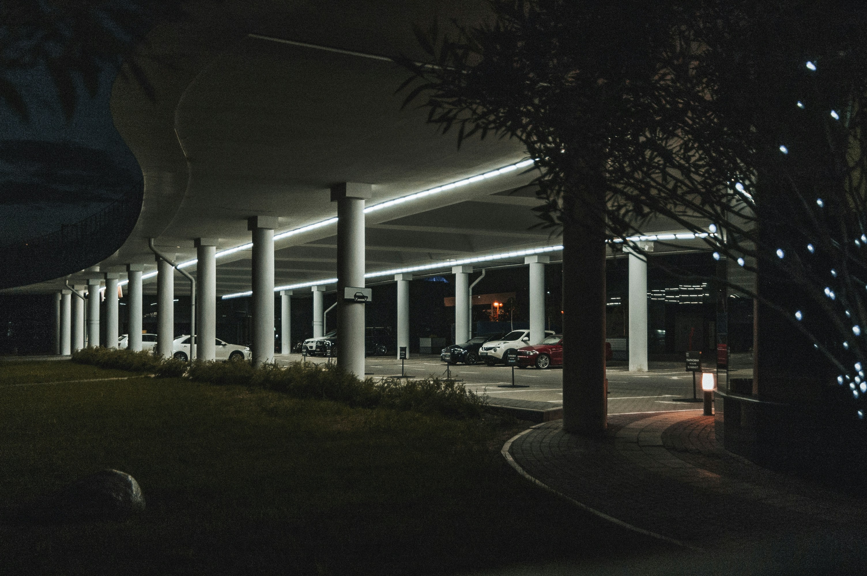 Aerial view of a lot full of used electric vehicles lined up for sale