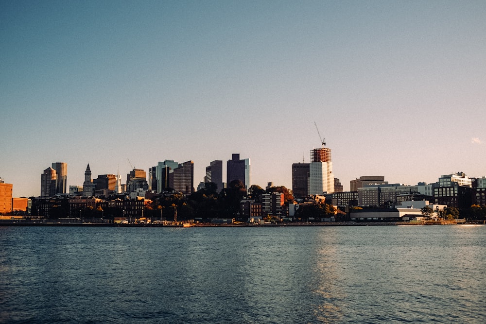 a large body of water with a city in the background