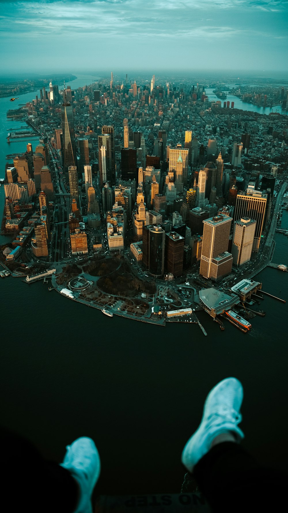 a person standing in front of a large city