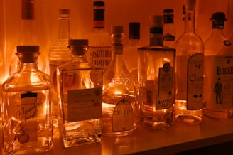 a row of liquor bottles sitting on top of a counter