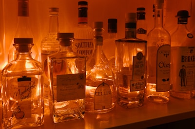 a row of liquor bottles sitting on top of a counter