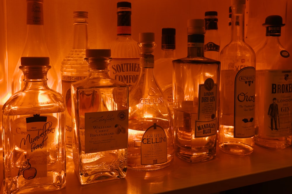 a row of liquor bottles sitting on top of a counter