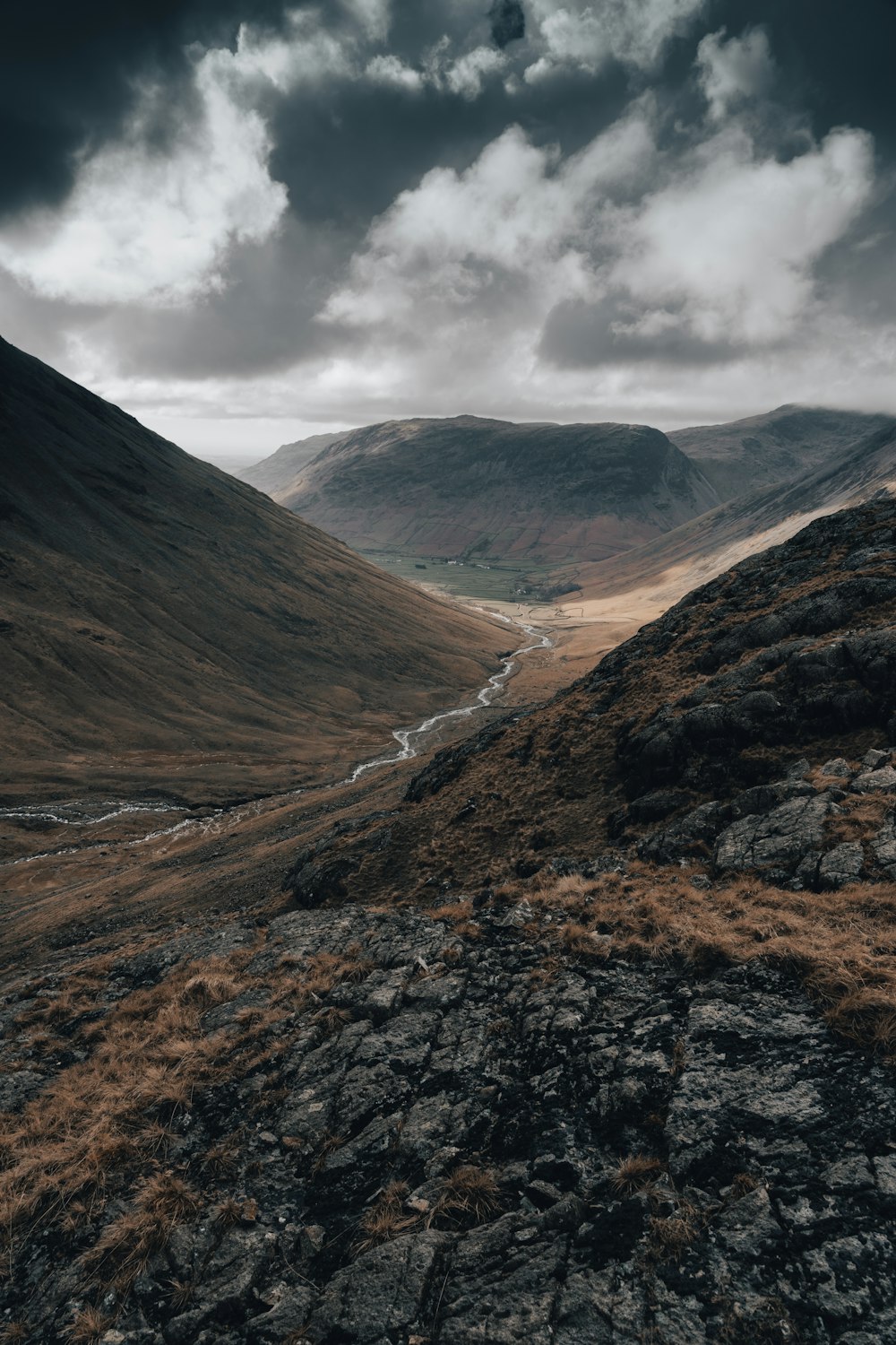 a view of a valley with a river running through it