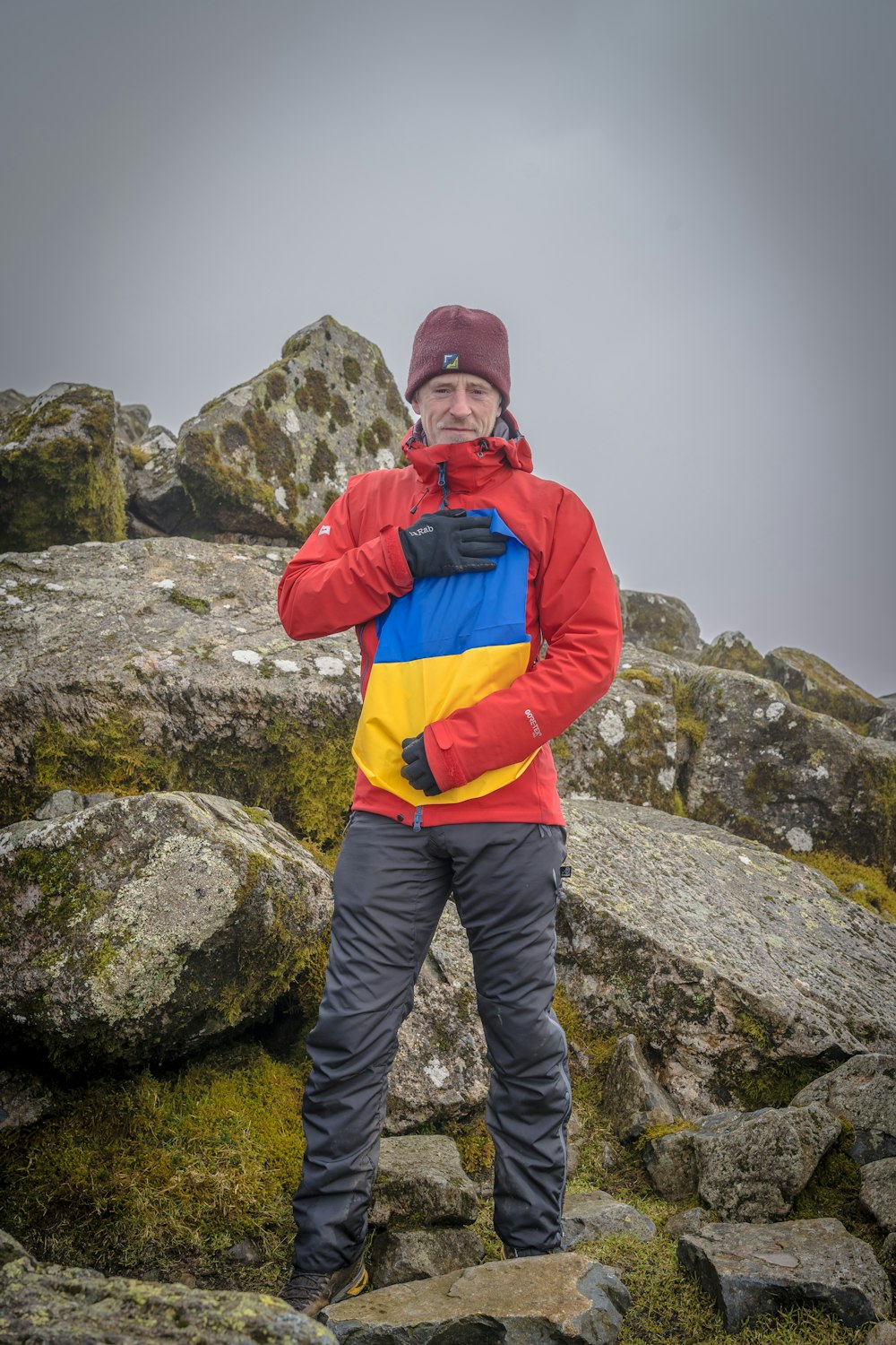 a man standing on top of a rocky mountain