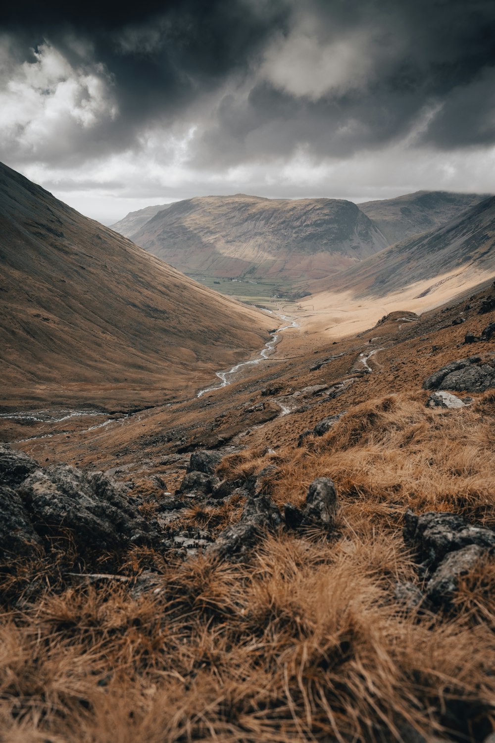 a view of a valley with a river running through it