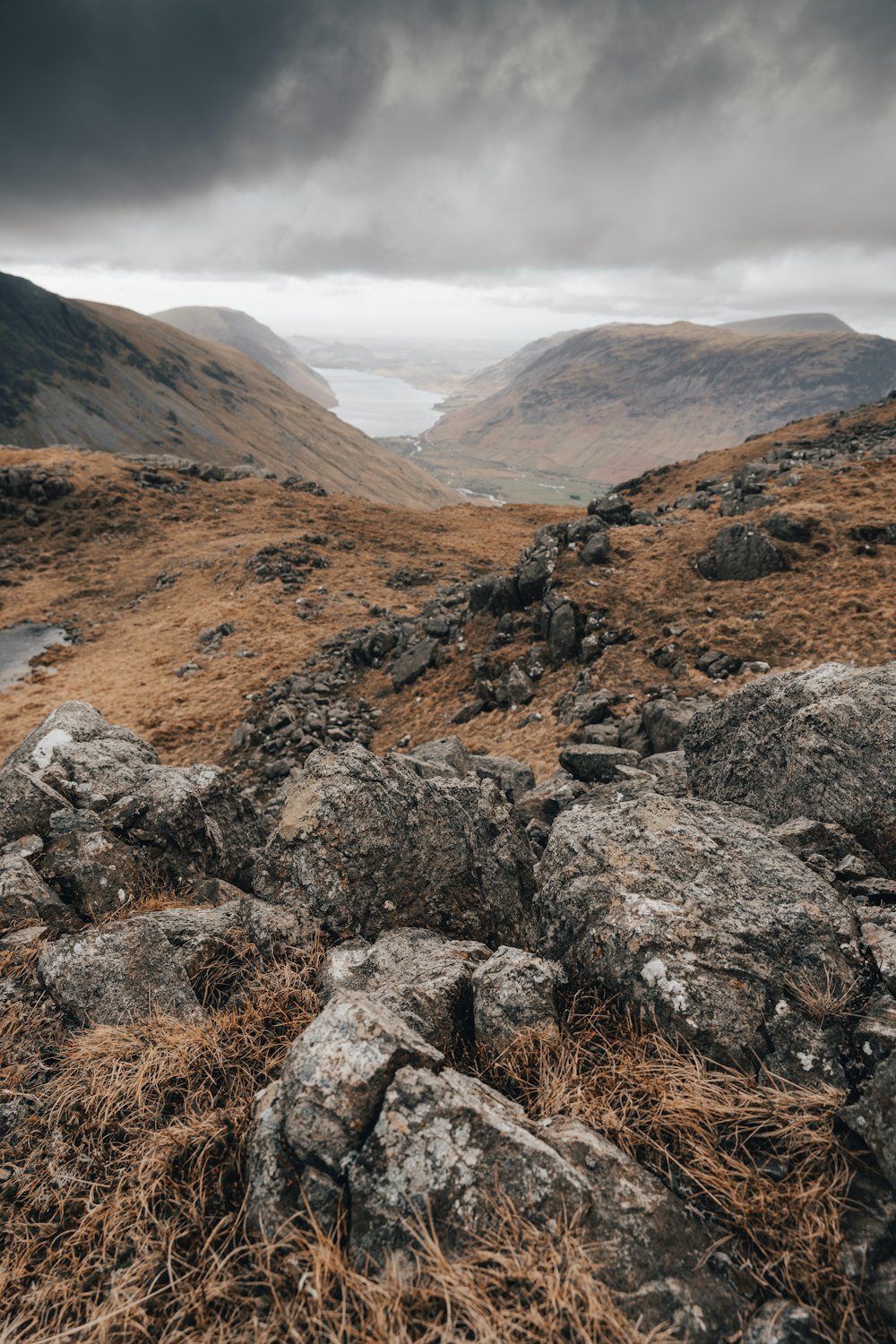 a view of a mountain range with a cloudy sky