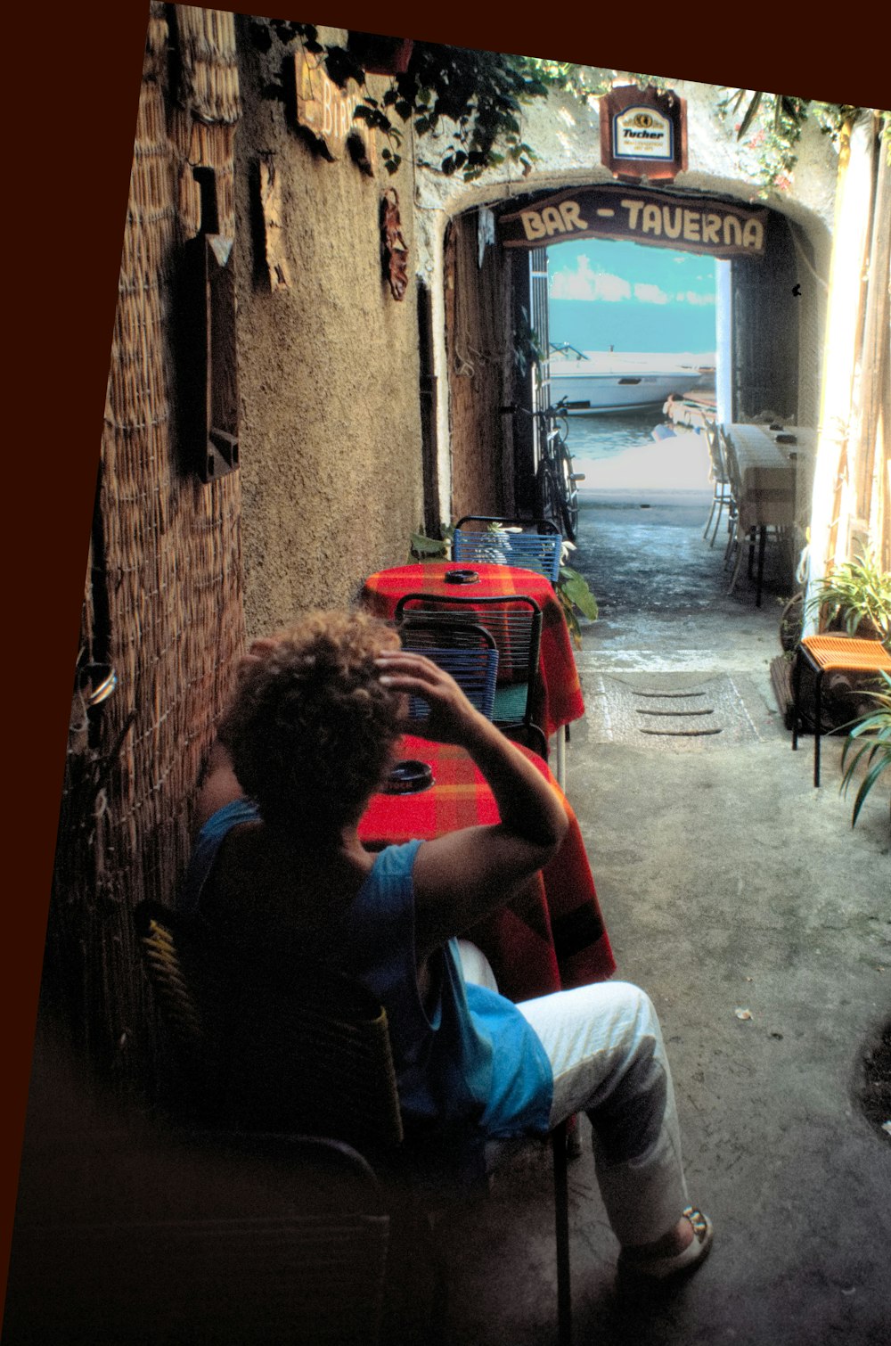 a person sitting on a chair in a restaurant