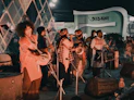 a group of people standing around each other