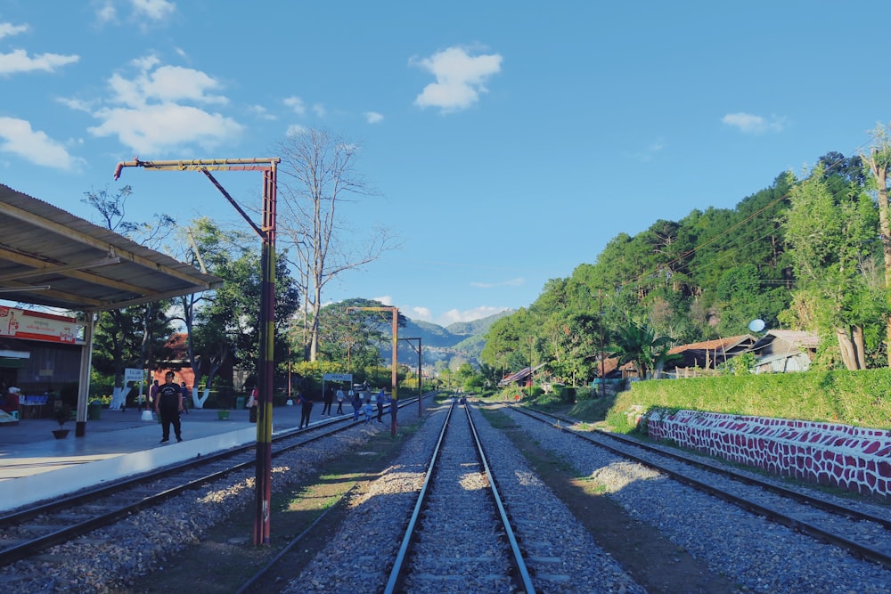 a train station with a train on the tracks