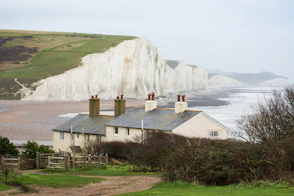 a house on a hill overlooking the ocean