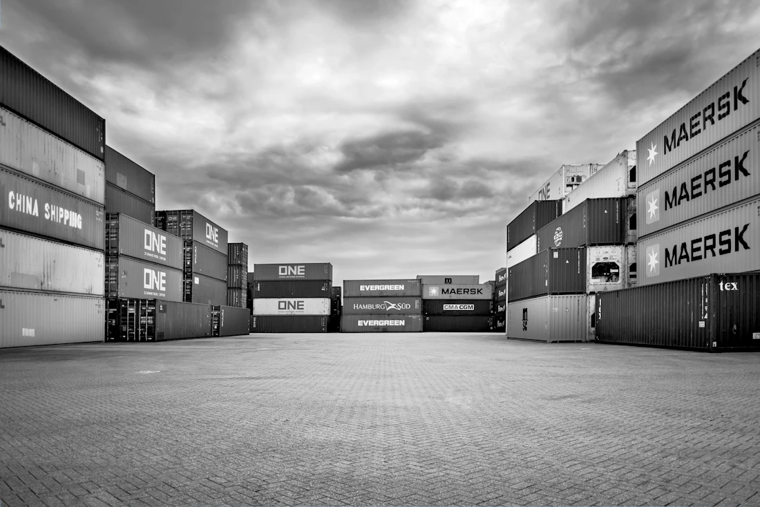 Black and white cargo containers representing international trade